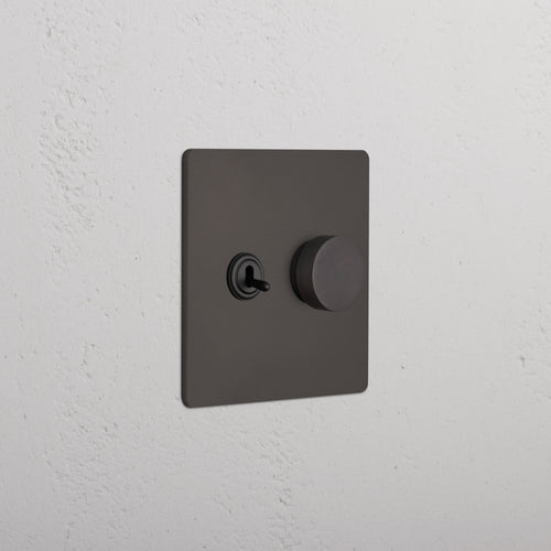 Grove 2G Toggle & Dimmer Switch in bronze finish, featuring a toggle switch and round dimmer knob.