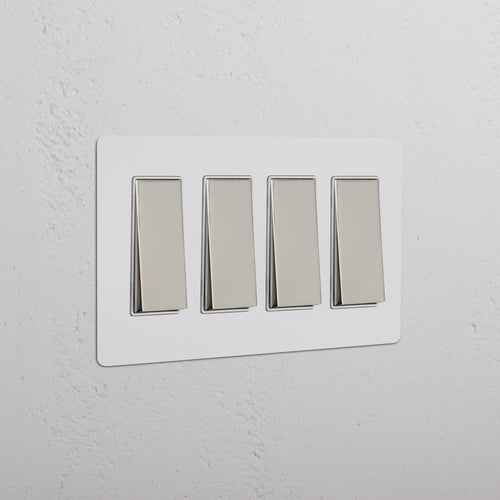 Kew 4G Rocker Switch in Paintable Polished Nickel White with four silver rocker switches on a white plate.