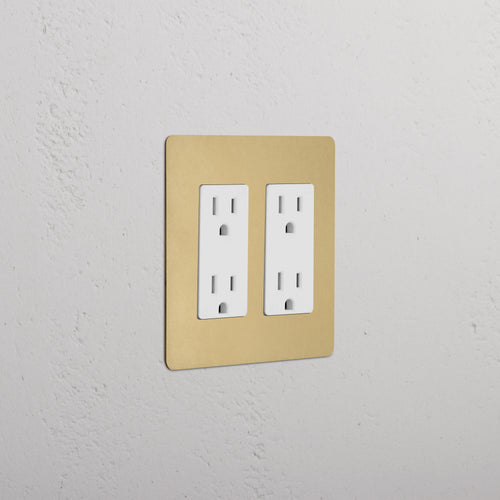 Kew 2G Outlet in antique brass white finish, double socket electrical outlet on a wall.
