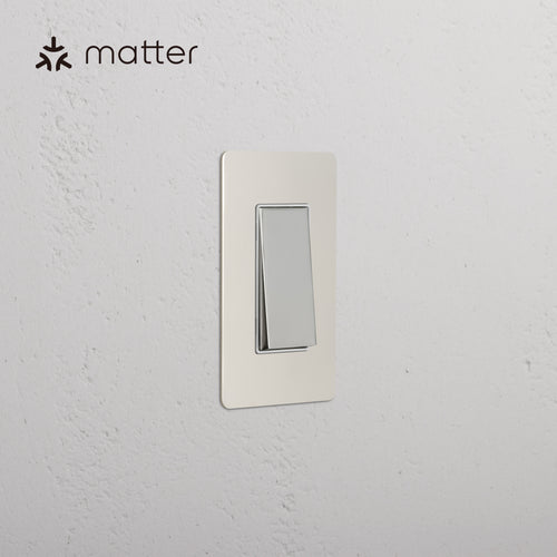 Kew 1G Smart Retractive Rocker Switch in Polished Nickel White mounted on textured white wall, Matter logo shown.