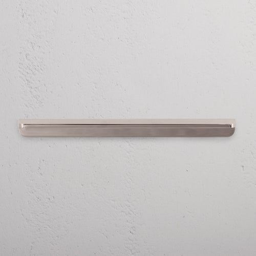 Medium-sized Oxford Furniture Handle in polished nickel finish, shown mounted on a light-colored surface.