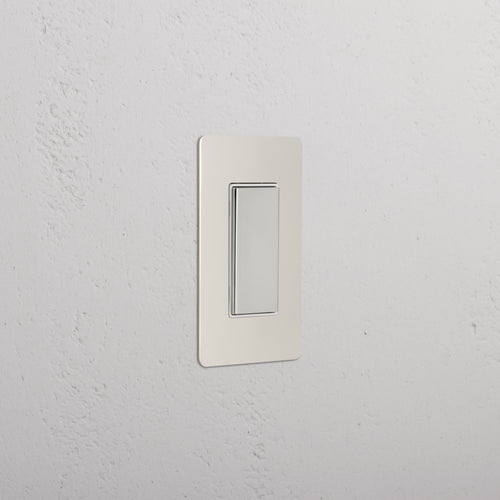 Kew 1G Center Retractive Rocker Switch in polished nickel white with a modern, rectangular design.