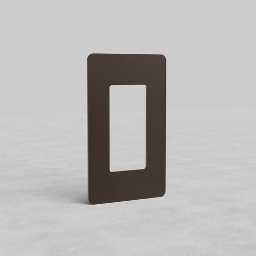 Rectangular bronze 1G outlet plate Kew US with a central cutout, shown upright on a light background.