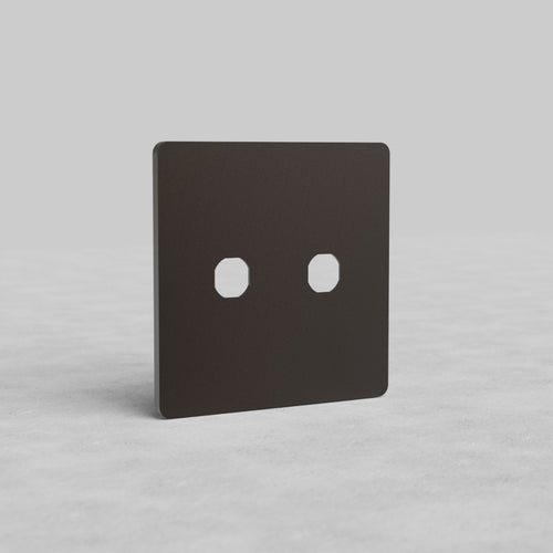 Bronze 2G Switch Plate Grove US with two switch openings, displayed upright on a light surface.