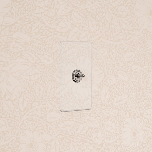 Kew 1G Center Retractive Toggle Switch in clear polished nickel with a rectangular faceplate, wall-mounted.