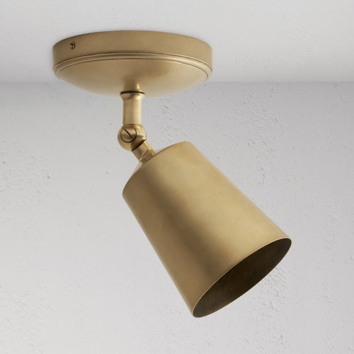 Baylis Single 70mm Spotlight in antique brass, adjustable cylindrical shade on round base for ceiling lighting.