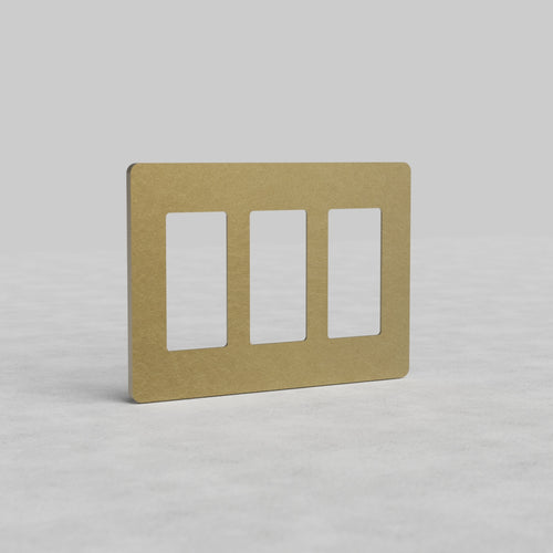 3G Outlet Plate Grove US in antique brass with three vertical rectangular openings, shown on a light background.