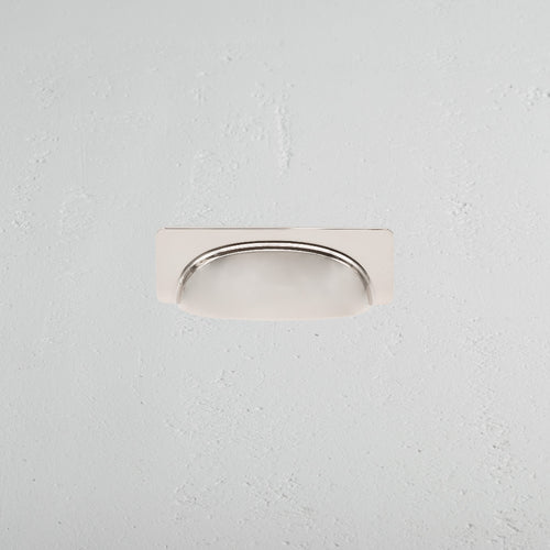 Elm Cup Handle Small in polished nickel finish, mounted horizontally on a light gray textured surface.