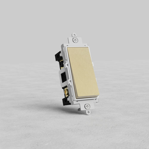 Four Way Rocker Switch in antique brass with white rocker, shown on a light gray surface against a plain background.