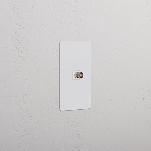 Kew 1G TV Keystone in paintable white, single gang wall plate with central port for TV cable connection.