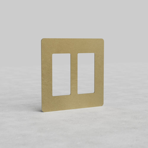 Antique brass 2G outlet plate Kew US with two vertical cutouts on a light background.