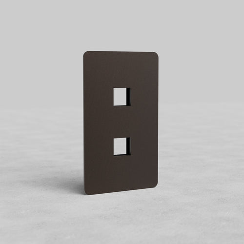 Bronze 1-gang 2-port keystone wall plate (Kew US) with two rectangular cutouts, shown upright.