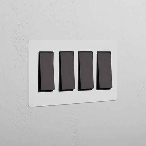 Kew 4G Rocker Switch in Paintable Bronze Black finish with four black rocker switches on a single plate.