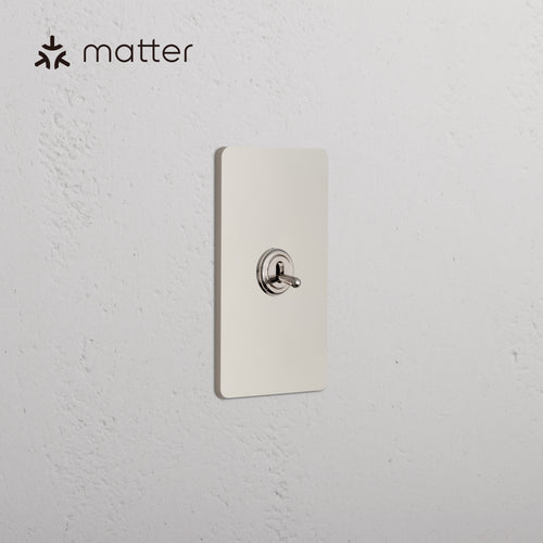 Grove 1G Smart Retractive Toggle Switch in Polished Nickel, single rectangular plate with toggle switch.