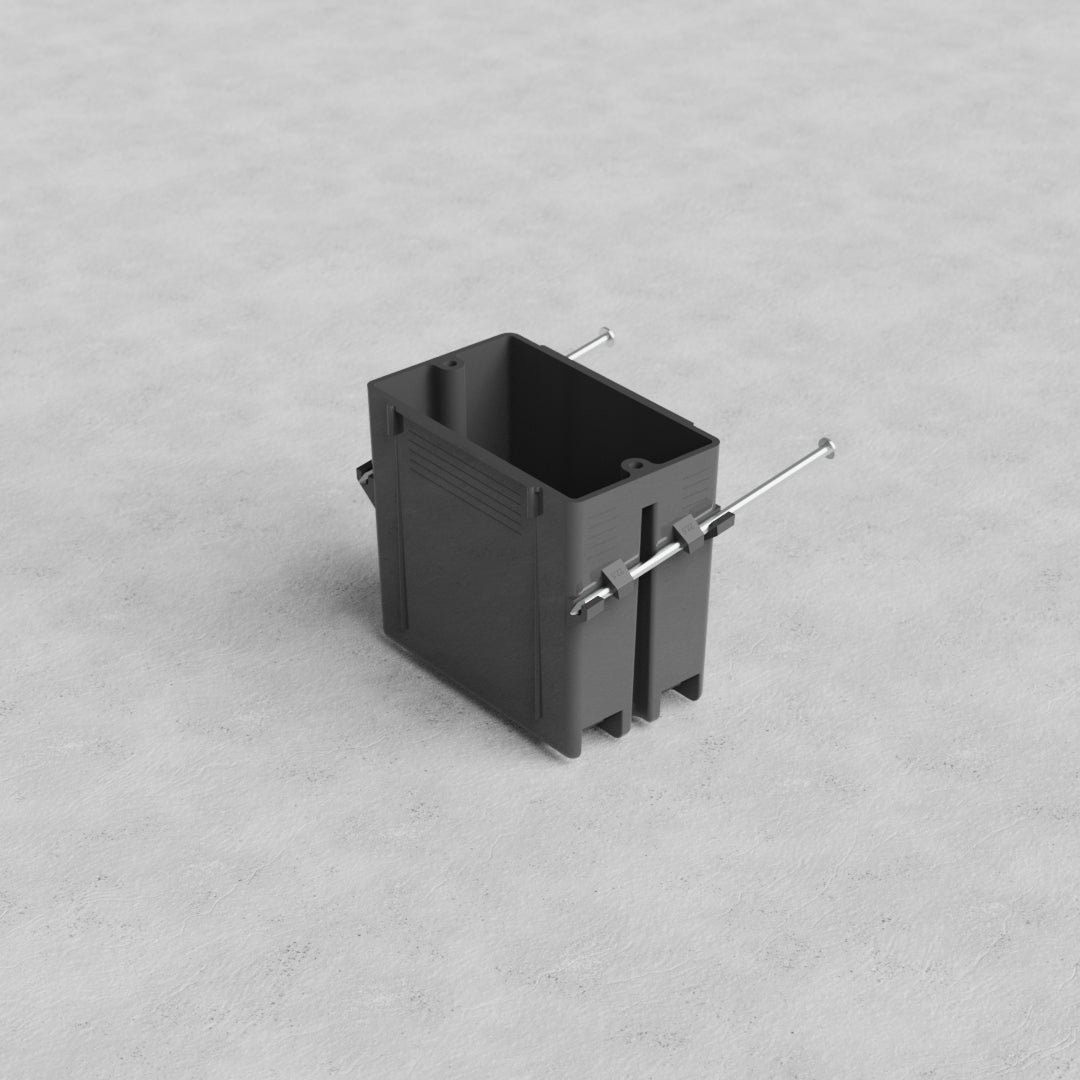 1G US New Work Electrical Box in black plastic with metal screws, shown on a light gray textured surface.