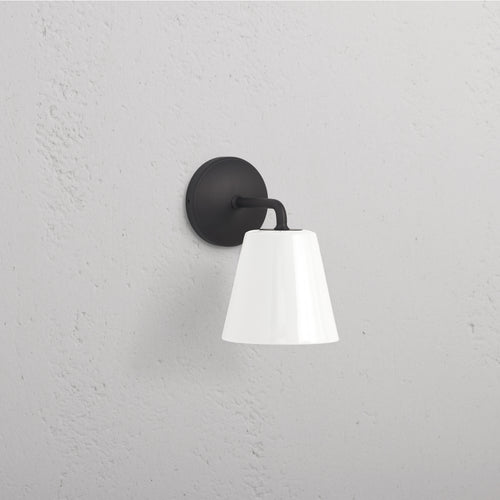 Richmond Medium Wall Light Fine Porcelain in bronze with a white shade, mounted on a textured white wall.