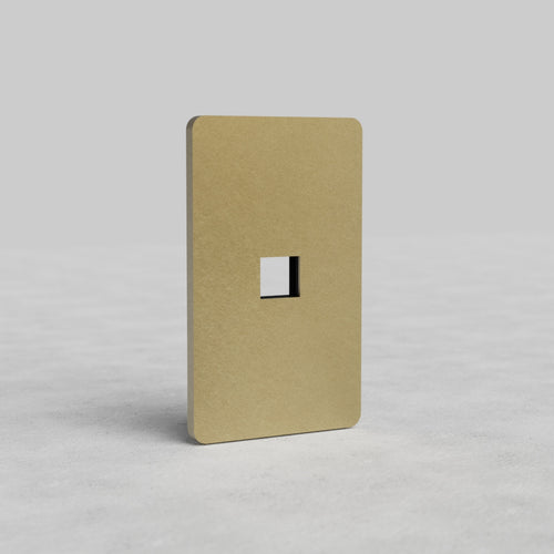 Antique brass 1G Keystone Plate Grove US with a central keystone opening, shown upright on a neutral background.