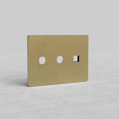 Antique brass 3-gang 2x switch and keystone plate Grove US, rectangular faceplate with cut-outs.