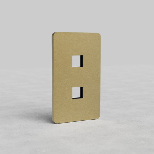Antique brass 1-gang, 2-port keystone wall plate (Grove US), with two square cutouts for inserts.