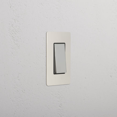 Kew 1G Rocker Switch in Polished Nickel Black with a black switch on a matching polished nickel plate.